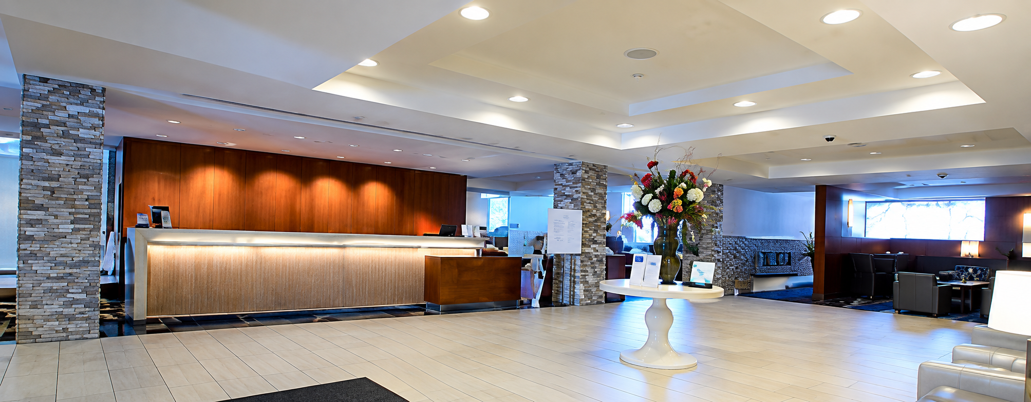 Recessed lighting and illuminated reception desk in a lobby
